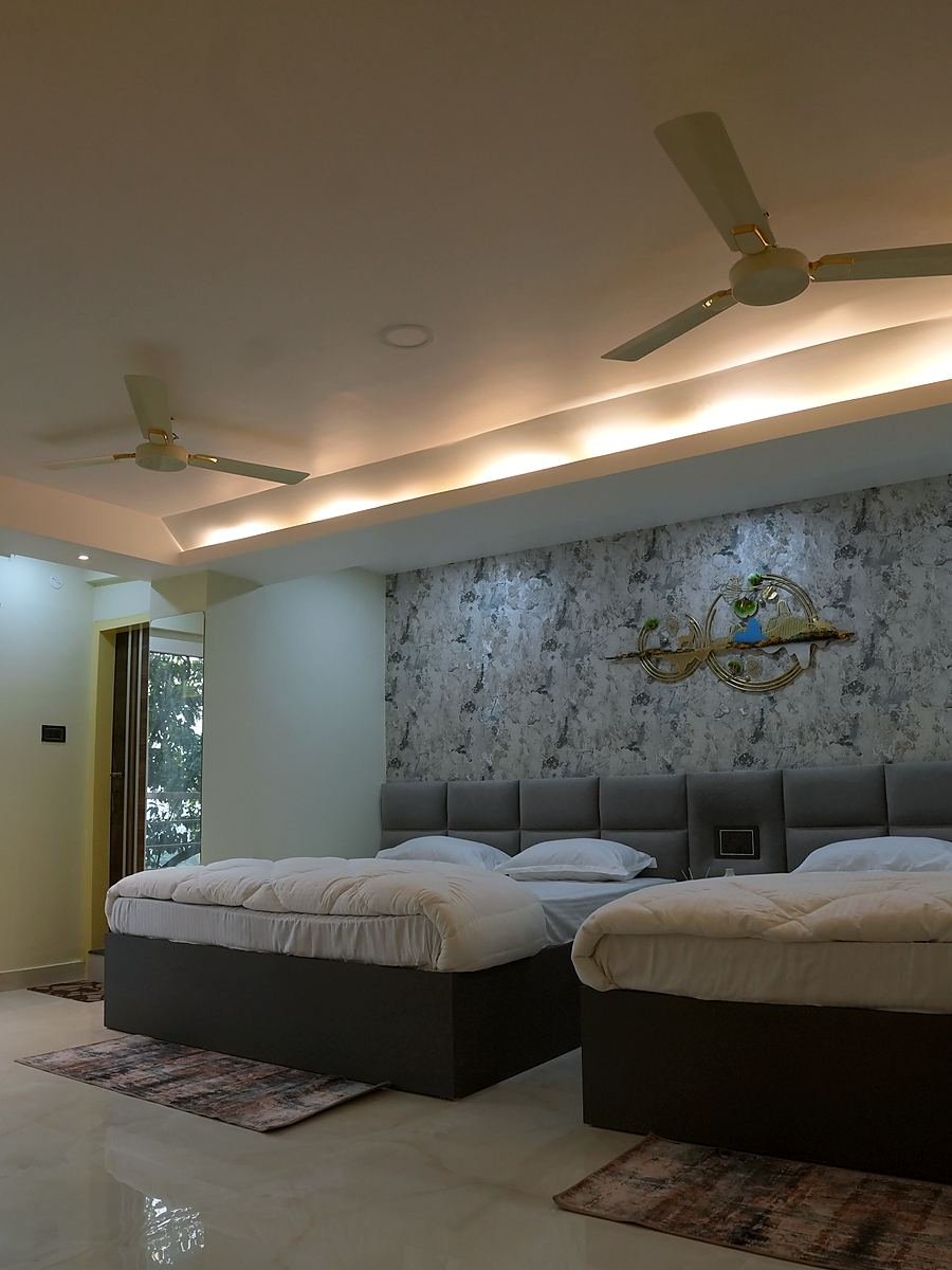 Family Room — two large beds in a bright room with wide windows
